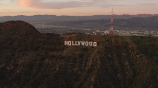 4K aerial stock footage of flying by the Hollywood Sign, Los Angeles, California, sunset Aerial Stock Footage | DCA07_002