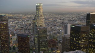 4K aerial stock footage of flying by Downtown skyscrapers, revealing US Bank Tower, Los Angeles, California, twilight Aerial Stock Footage | DCA07_022