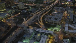 4K aerial stock footage of flying by Highway 101, pan left, Downtown Los Angeles, California, night Aerial Stock Footage | DCA07_027