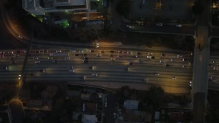 DCA07_032 - 4K aerial stock footage of bird's eye view flying over Highway 101, heavy traffic, Echo Park, California, night