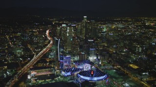 DCA07_063 - 4K aerial stock footage of Staples Center, The Ritz-Carlton, Nokia Theater, LA Live and skyscrapers, Downtown Los Angeles, California, night