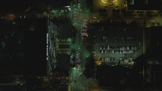 DCA07_069 - 4K aerial stock footage of following Wilshire Blvd from South Harvard Street to South Oxford Avenue, Koreatown, Los Angeles, California, night