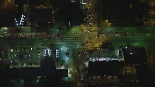 DCA07_071 - 4K aerial stock footage of bird's eye view following WIshire Blvd from South Wilson Place to South Bronson, Koreatown, Los Angeles, California, night 