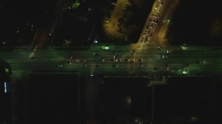 DCA07_072 - 4K aerial stock footage of bird's eye view following Wilshire Boulevard from South Bronson to South Windsor, Koreatown, Los Angeles, California, night