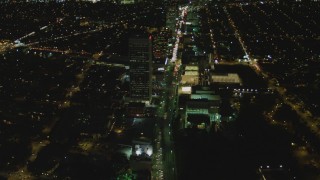 4K aerial stock footage of following Wilshire Blvd through Mid-Wilshire, Los Angeles, California, night Aerial Stock Footage | DCA07_077