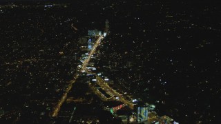 4K aerial stock footage of approaching the Sunset Strip, West Hollywood, California, night Aerial Stock Footage | DCA07_094