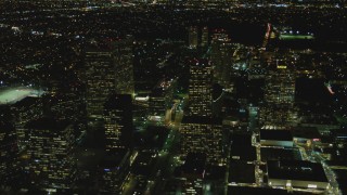 4K aerial stock footage of flying by skyscrapers, revealing Avenue of the Stars, Century City, California, night Aerial Stock Footage | DCA07_103