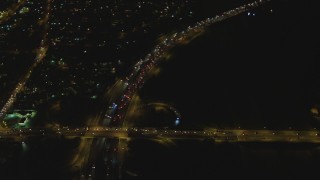 4K aerial stock footage of flying away from Interstate 710, Lynwood, California, night Aerial Stock Footage | DCA07_117