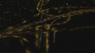 4K aerial stock footage of flying away from Highway 91 and Interstate 710 interchange, Long Beach, California, night Aerial Stock Footage | DCA07_121