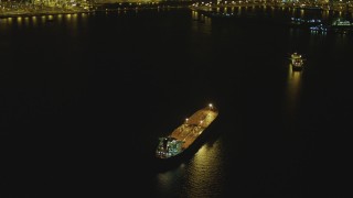 DCA07_146 - 4K aerial stock footage of on oil tanker near Port of Long Beach, California, night