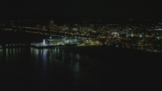 DCA07_171 - 4K aerial stock footage of flying by Santa Monica Pier, Santa Monica, California, night