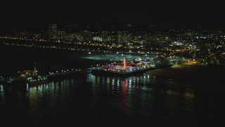 DCA07_172 - 4K aerial stock footage of flying by the Santa Monica Pier, Santa Monica, California, night