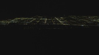 4K aerial stock footage tilt to reveal the San Fernando Valley, San Fernando Valley, California, night Aerial Stock Footage | DCA07_176