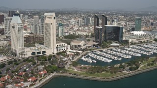 4K aerial stock footage flyby waterfront hotels in Downtown San Diego, California Aerial Stock Footage | DCA08_013E