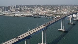 4K aerial stock footage orbit Coronado Bridge and reveal the skyline of Downtown San Diego, California Aerial Stock Footage | DCA08_021E