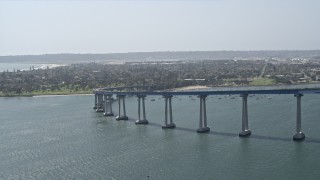 DCA08_023 - 4K aerial stock footage of a reverse view of the Coronado Bridge in San Diego, California