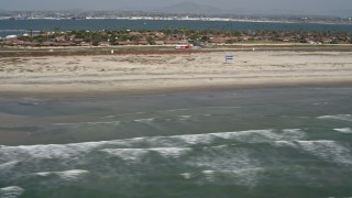 4K aerial stock footage of ocean waves and beach in Coronado, California Aerial Stock Footage | DCA08_026