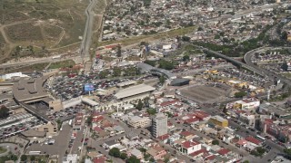 DCA08_063 - 4K aerial stock footage approach and tilt to heavy border traffic on the US/Mexico Border, Tijuana