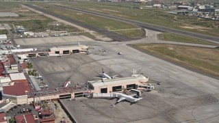 4K aerial stock footage of terminals, passenger jets, and hangars at Tijuana International Airport, Mexico Aerial Stock Footage | DCA08_068