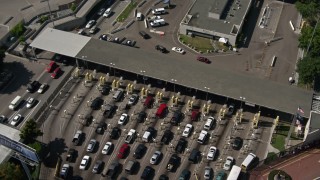 4K aerial stock footage approach the US/Mexico Border at Otay Mesa and tilt to a bird's eye of cars, California Aerial Stock Footage | DCA08_090