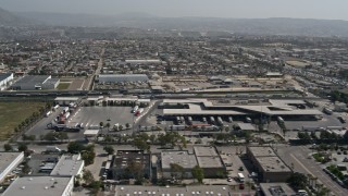 4K aerial stock footage of flying by the US/Mexico Border checkpoint in Otay Mesa, California Aerial Stock Footage | DCA08_093