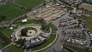 DCA08_114 - 4K aerial stock footage orbit Olympic training grounds, parking lots in Chula Vista, California