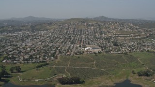 DCA08_122 - 4K aerial stock footage tilt to reveal reservoir and suburban neighborhoods, Spring Valley, California