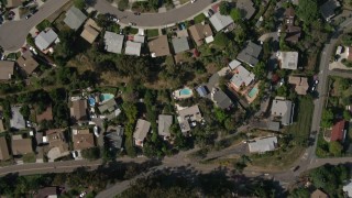 DCA08_131E - 4K aerial stock footage of a bird's eye of a suburban neighborhood, reveal strip mall, freeway interchange, high school, La Mesa, California