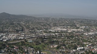 4K aerial stock footage tilt from suburban homes to reveal shopping mall, La Mesa, California Aerial Stock Footage | DCA08_133