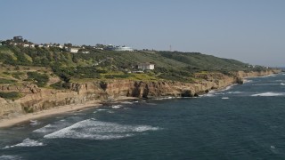 4K aerial stock footage flyby coastal cliffs and a small beach in Point Loma, California Aerial Stock Footage | DCA08_161