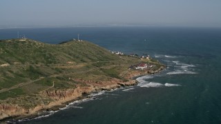 4K aerial stock footage of coastal cliffs and lighthouse in Point Loma, California Aerial Stock Footage | DCA08_166