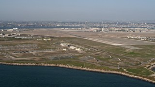 4K aerial stock footage of bunkers and runways on an island military base, Naval Air Station North Island, California Aerial Stock Footage | DCA08_170