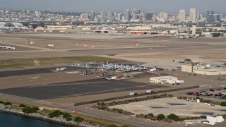 4K aerial stock footage of military jets and helicopters on an island base, Naval Air Station North Island, California Aerial Stock Footage | DCA08_172