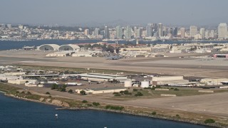 4K aerial stock footage of runways  and hangars on an island military base, Naval Air Station North Island, California Aerial Stock Footage | DCA08_173