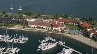 4K aerial stock footage of a reverse view of an oceanfront hotel, Shelter Island, California Aerial Stock Footage | DCA08_175