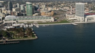 4K aerial stock footage of tracking a military helicopter flying by Downtown San Diego, California Aerial Stock Footage | DCA08_182