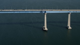 DCA08_183 - 4K aerial stock footage tilt from sailboat to reveal the Coronado Bridge, San Diego, California