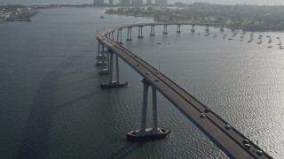 DCA08_203 - 4K aerial stock footage of tracking cars crossing the Coronado Bridge, San Diego, California