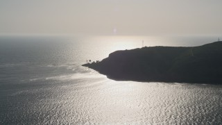 4K aerial stock footage approach an oceanfront lighthouse in Point Loma, California Aerial Stock Footage | DCA08_217