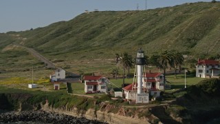 DCA08_219 - 4K aerial stock footage orbit an oceanside lighthouse, Point Loma, California