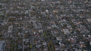 4K aerial stock footage reverse and pan across suburban houses and apartment buildings, Pacific Beach, California, Sunset Aerial Stock Footage | DCA08_284