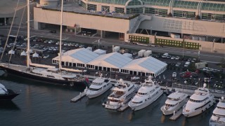 DCA08_297 - 4K aerial stock footage of convention center displays and parking lot,, Downtown San Diego California, Sunset