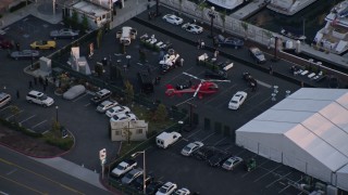 4K aerial stock footage of movie props at convention center parking lot, Downtown San Diego, California, Sunset Aerial Stock Footage | DCA08_298