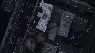 4K aerial stock footage of a bird's eye view of city streets and buildings in Downtown San Diego, California, Sunset Aerial Stock Footage | DCA08_326