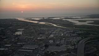 4K aerial stock footage pan across suburban houses, bay and SeaWorld theme park to the university, San Diego, California, Sunset Aerial Stock Footage | DCA08_329