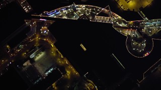 DCA08_349 - 4K aerial stock footage of a bird's eye view of a shopping mall at night in Downtown San Diego, California