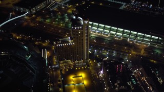 4K aerial stock footage fly over luxury hotels at night in Downtown San Diego, California, and tilt to reveal Coronado Aerial Stock Footage | DCA08_350