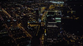 4K aerial stock footage of panning across the city to reveal a luxury waterfront hotel, Downtown San Diego, California, Night Aerial Stock Footage | DCA08_354