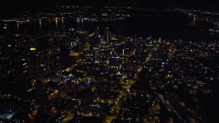 4K aerial stock footage of flying by city skyscrapers in Downtown San Diego, California, Night Aerial Stock Footage | DCA08_369