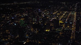 4K aerial stock footage video of panning from luxury hotels to approach skyscrapers at night in Downtown San Diego, California Aerial Stock Footage | DCA08_375E